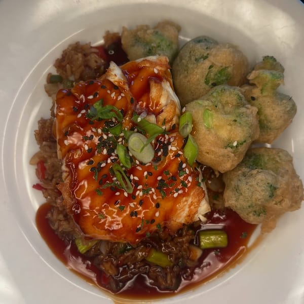 Salted. On The Harbor's salmon with teriyaki glaze, rice, and tempura broccoli.