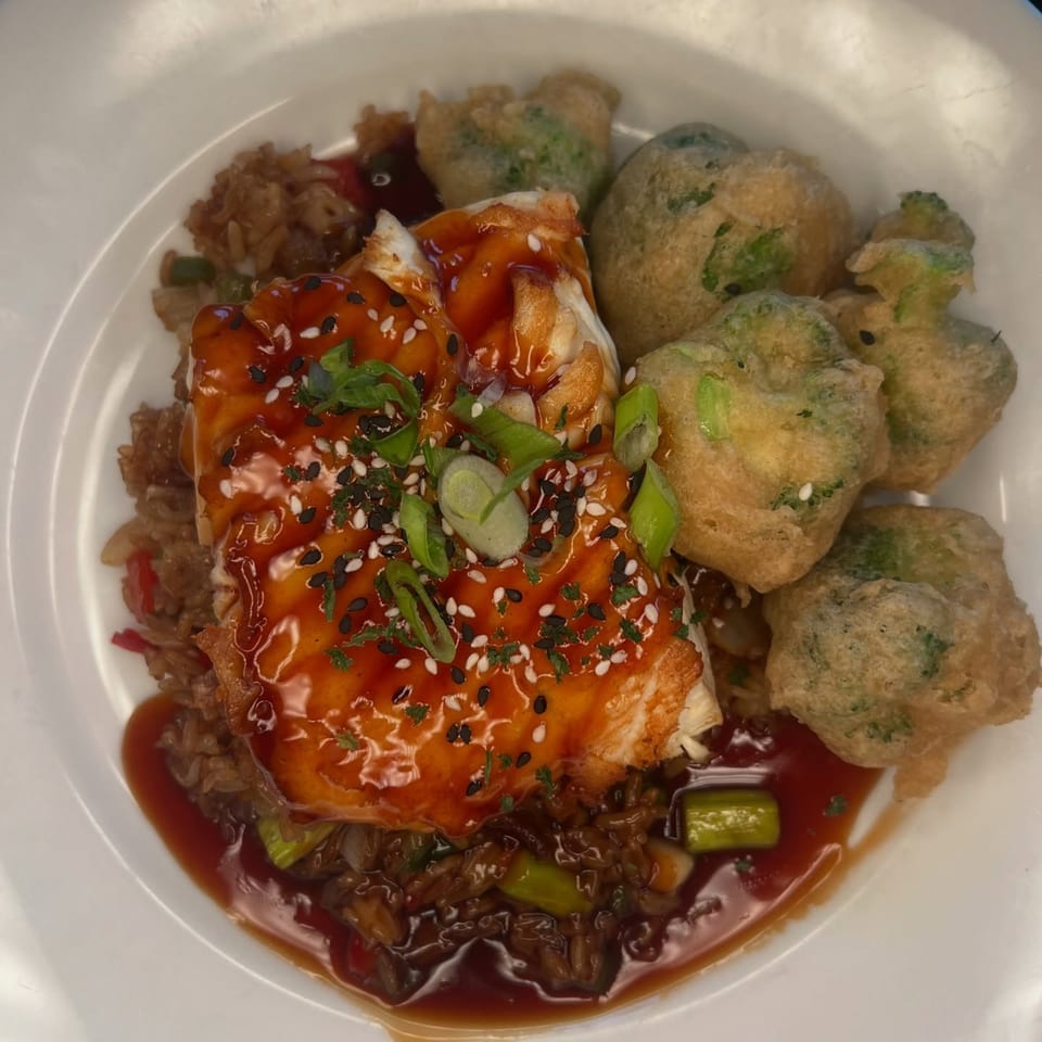 Salted. On The Harbor's salmon with teriyaki glaze, rice, and tempura broccoli.